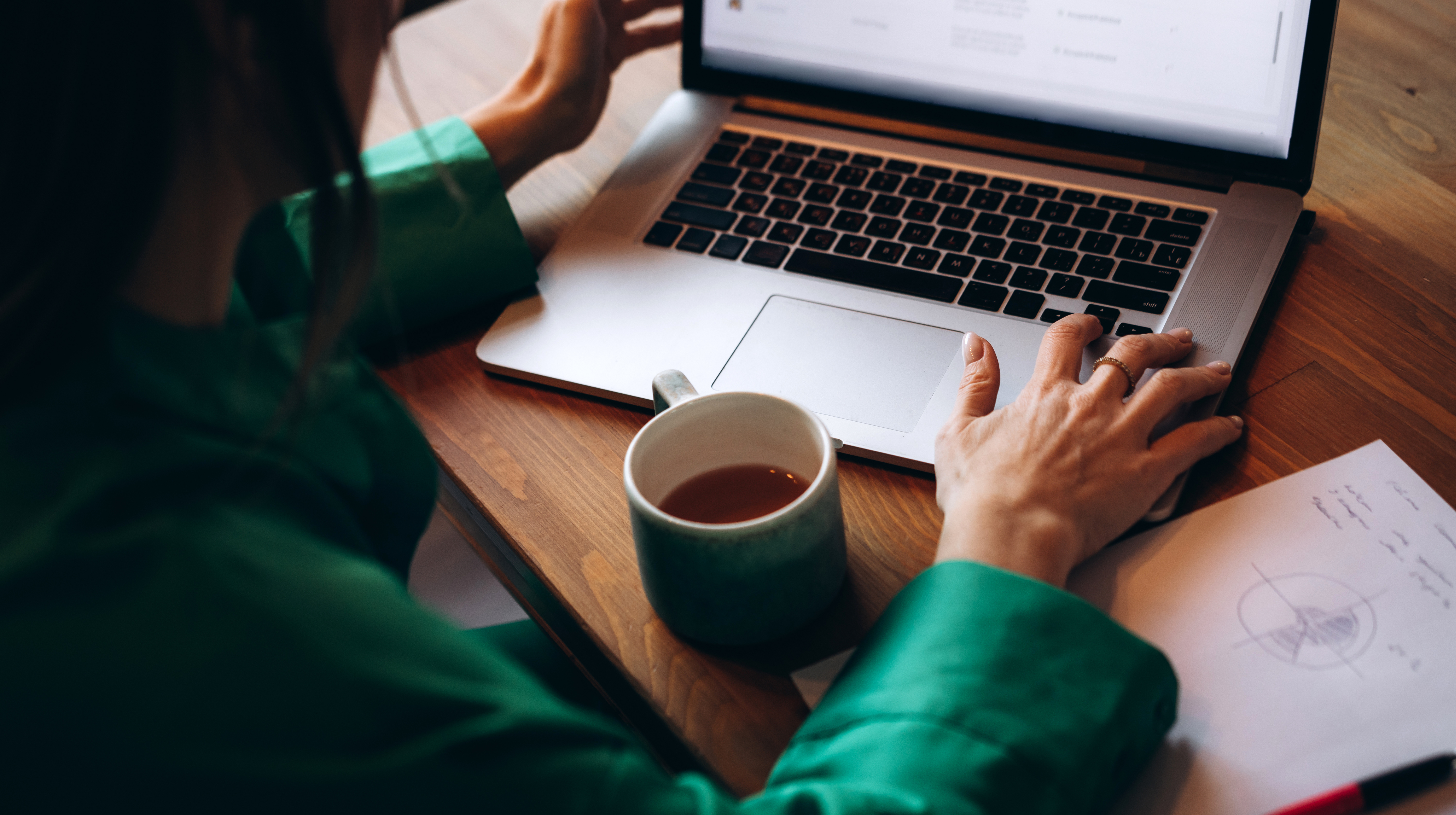 Man at desk smiling at desktop