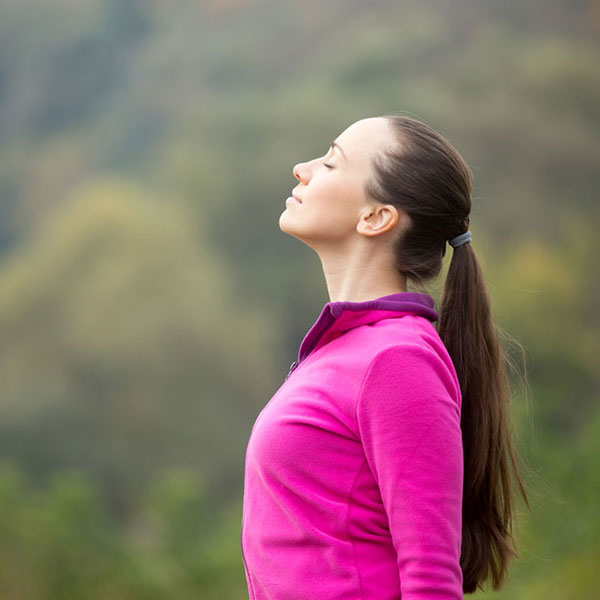Woman in nature managing stress