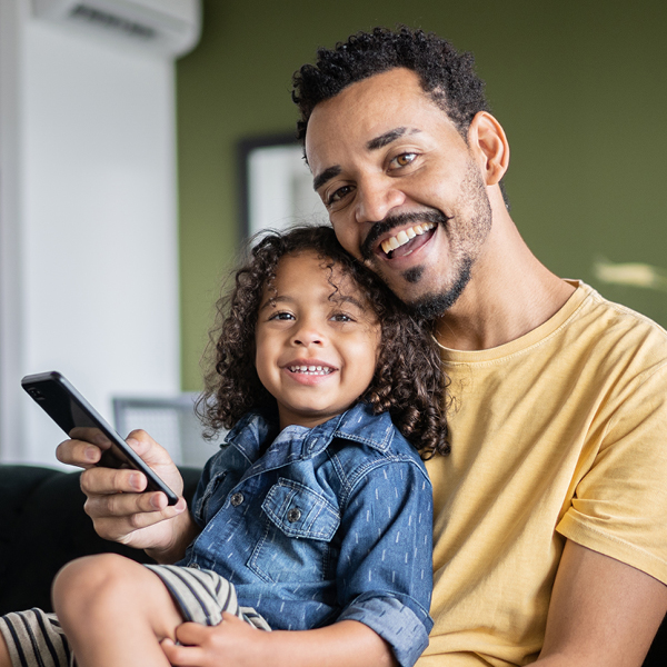 Father with daughter smiling together