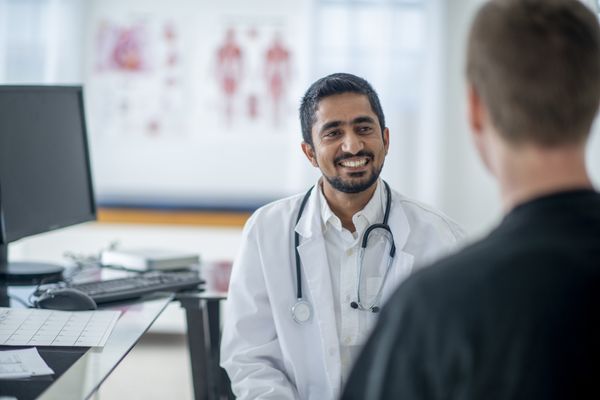 Family doctor helping a patient