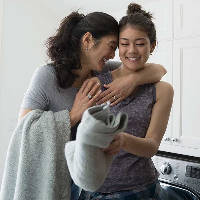 Mother smiling with daughter