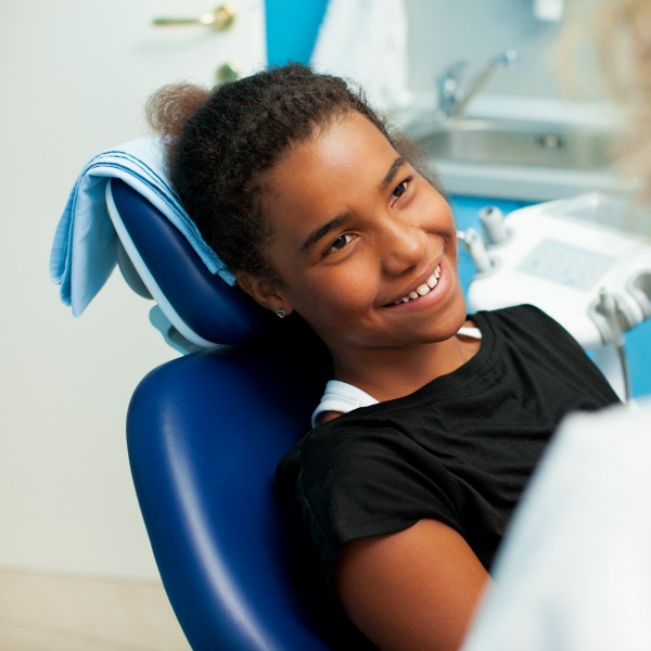 Girl smiling at the dentist