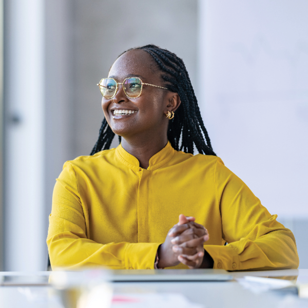 Young adult smiling with glasses